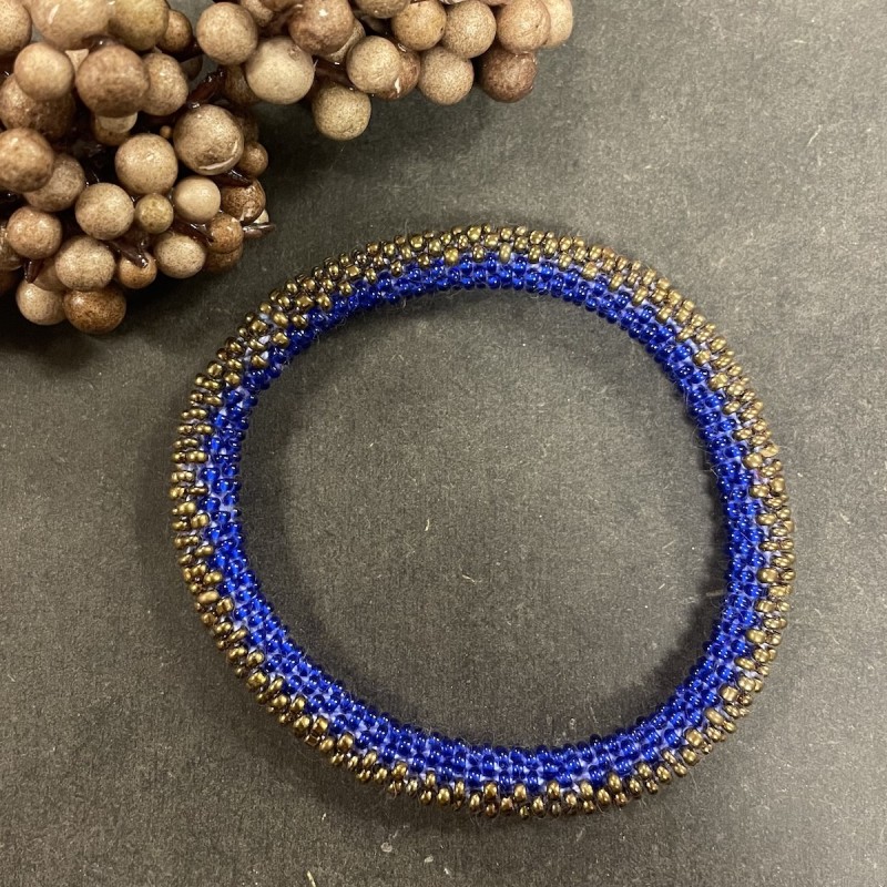 Billede af Nepali armbånd blå & guld perler